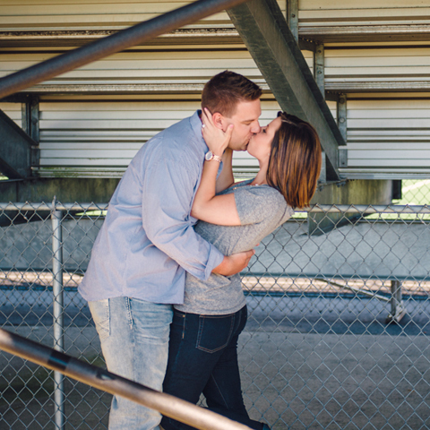 Milwaukee engagement photos at Greendale High School under the bleachers - The Paper Elephant